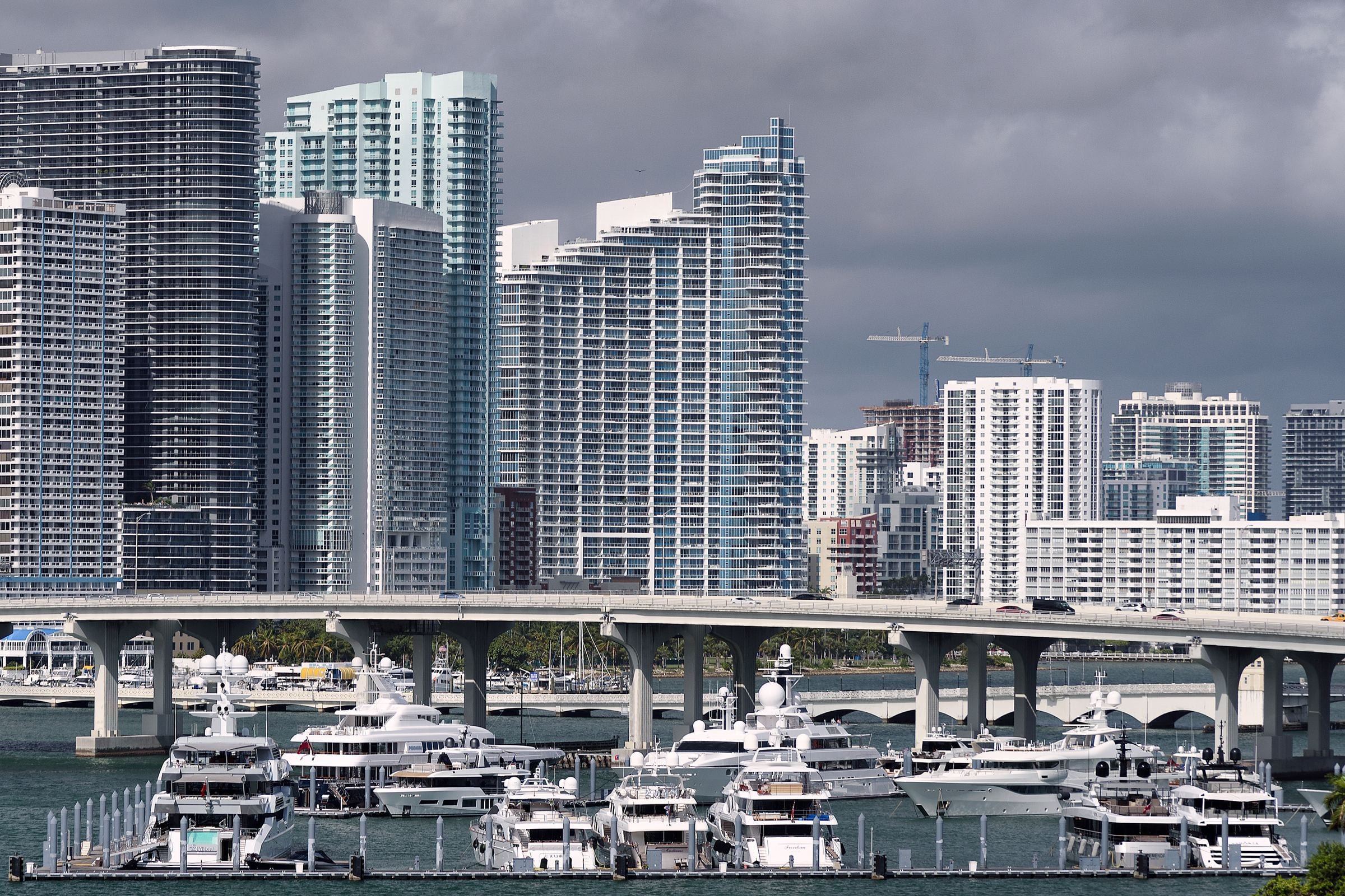 Biscayne Bay: yachts at their berths in the foreground, city towers behind.